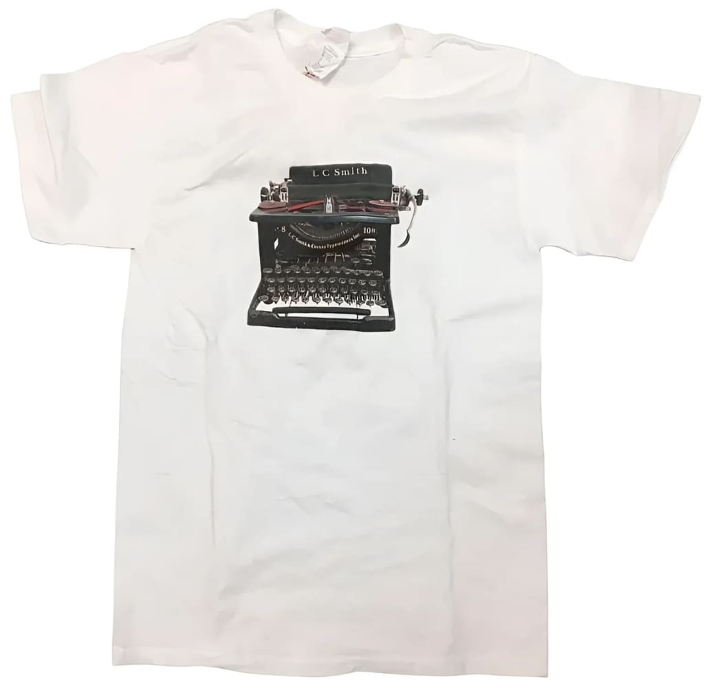 White t-shirt with typewriter graphic.