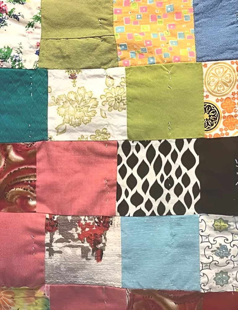 A colorful patchwork quilt made from various fabric squares.