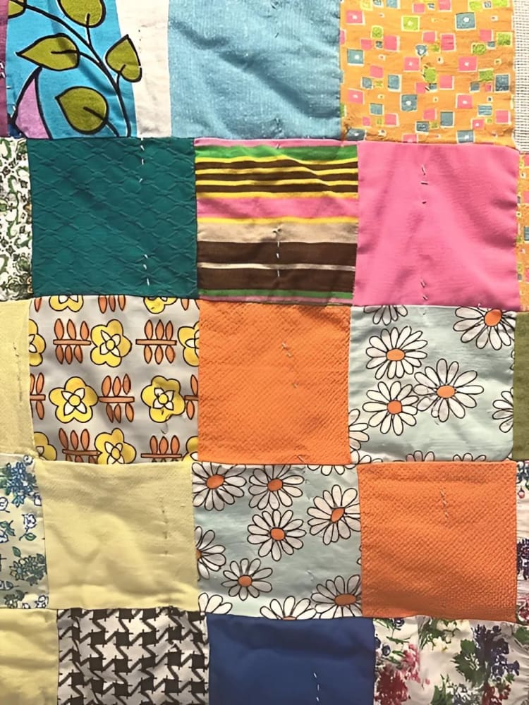 A colorful patchwork quilt made from various fabric scraps.