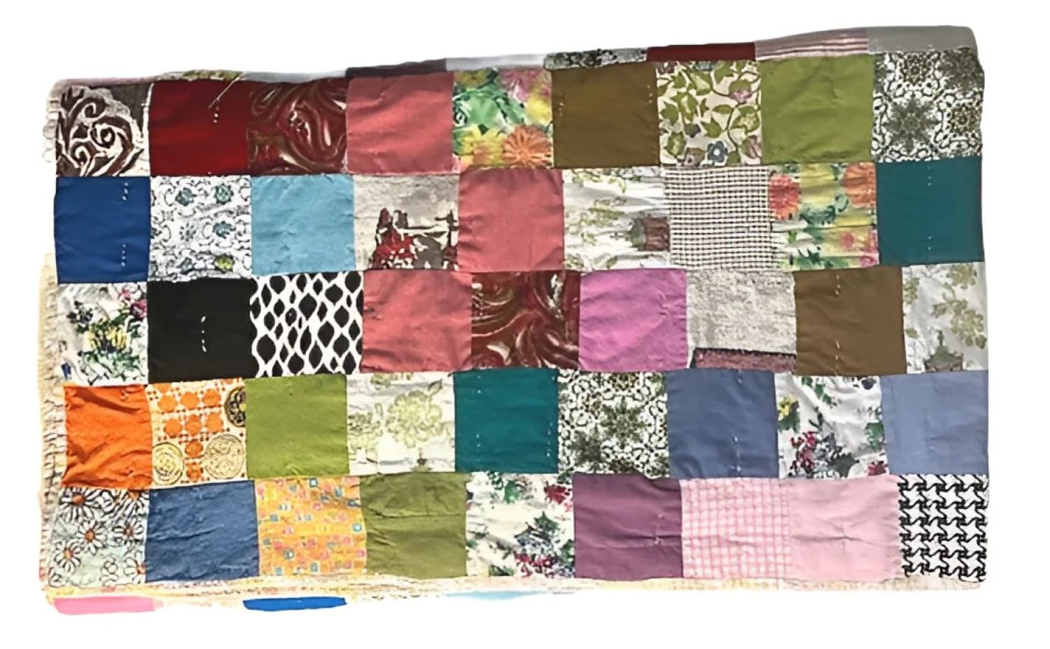 Handmade patchwork quilt with various colorful fabric squares.