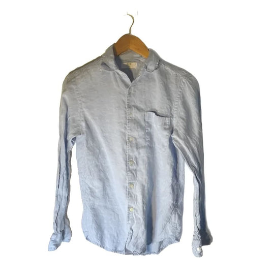 Light blue long-sleeve button-up shirt with a single chest pocket.