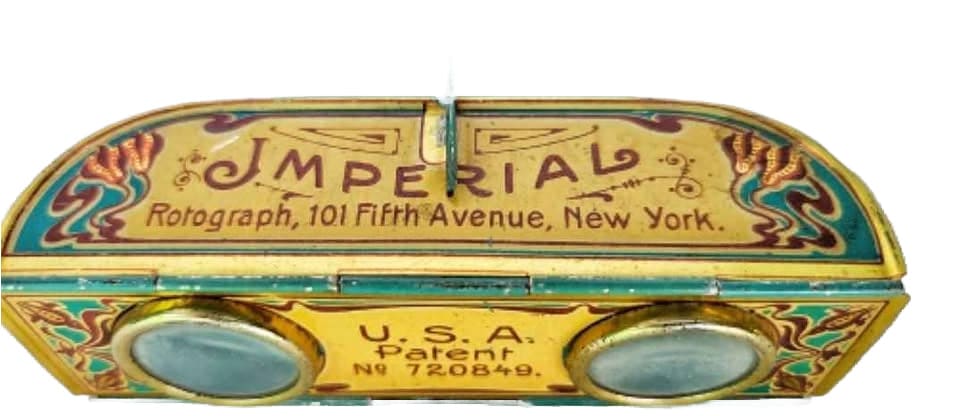 Gold-colored opera glasses with intricate Art Nouveau designs.