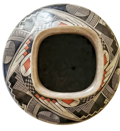 Hand-painted Native American pottery bowl with intricate geometric designs and a unique rectangular opening.