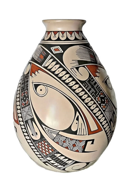 A hand-painted ceramic vase with Native American-inspired patterns in black, white, and terracotta colors.
