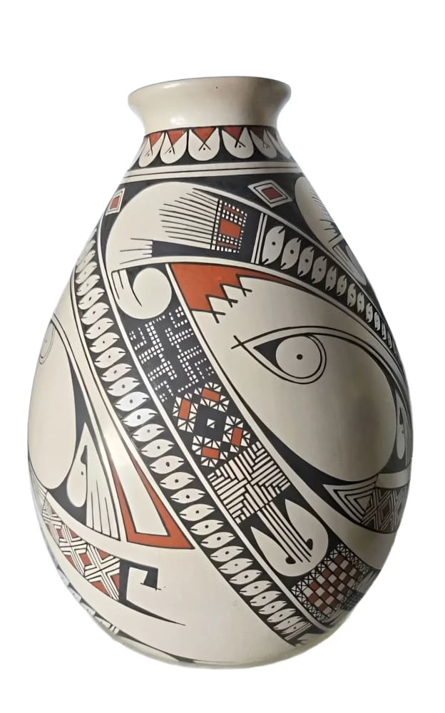 Hand-painted ceramic vase with a black, white, and terracotta geometric design.