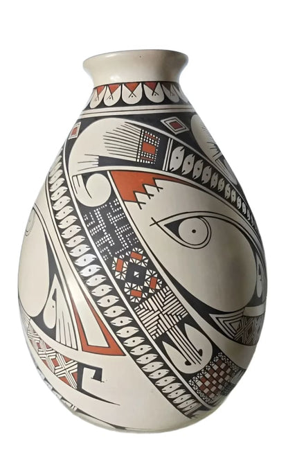 Hand-painted ceramic vase with a black, white, and terracotta geometric design.